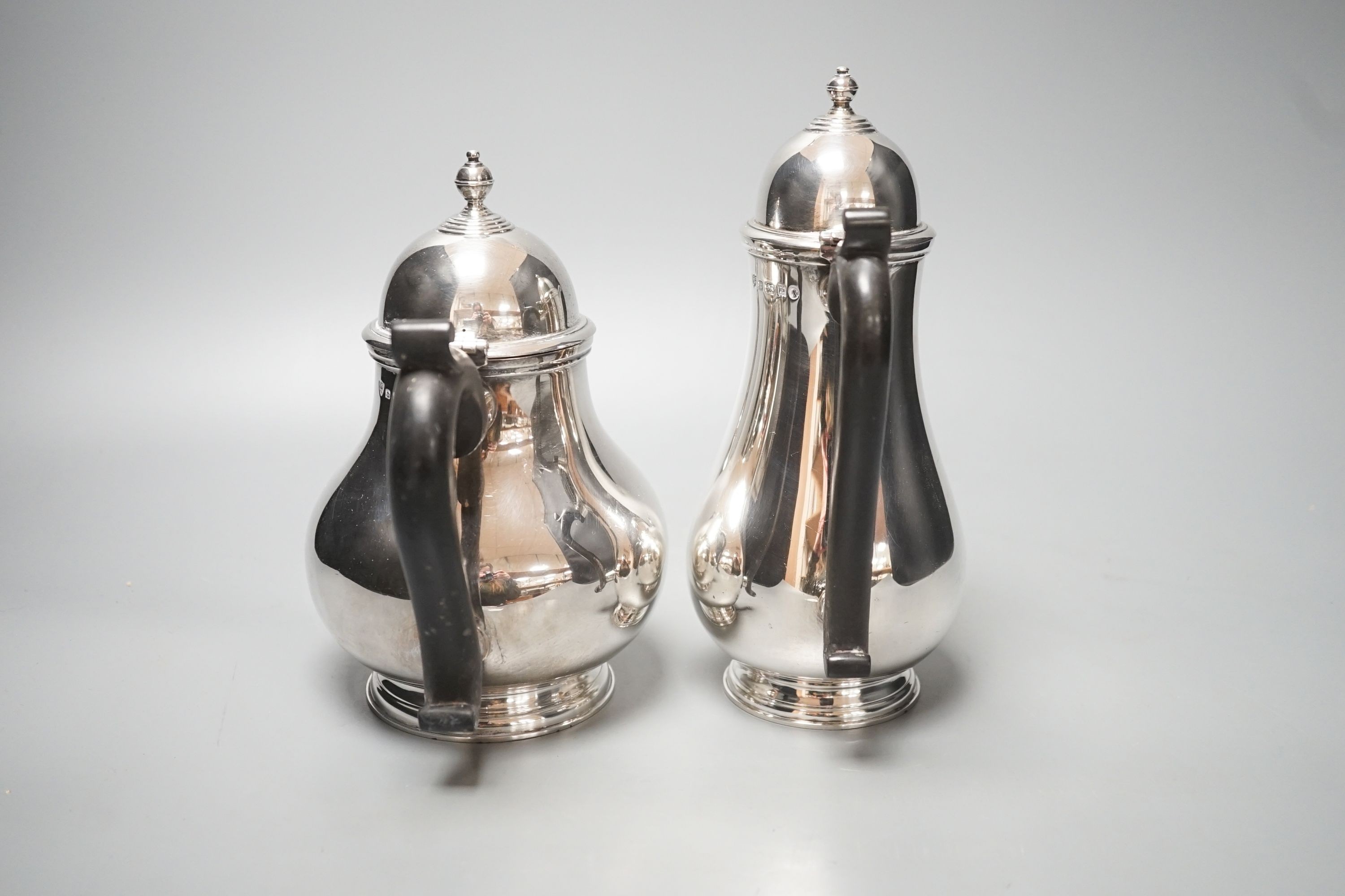 A 1930's silver coffee pot and a similar silver how water pot, Birmingham, 1934 & 1935, gross 39oz.